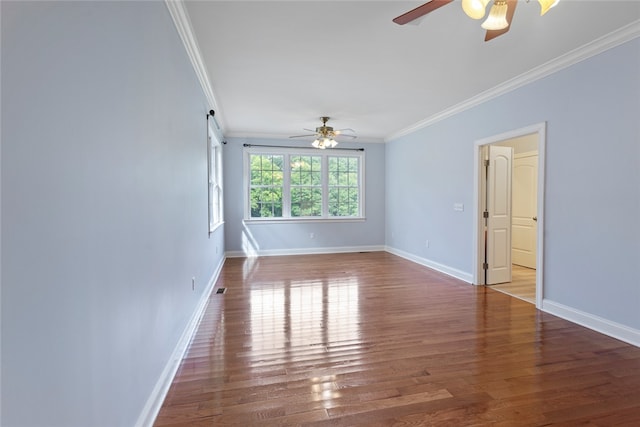 unfurnished room featuring crown molding, hardwood / wood-style floors, and ceiling fan