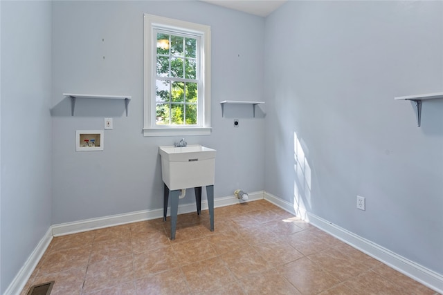 clothes washing area with light tile patterned floors, hookup for an electric dryer, and washer hookup