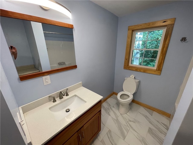 bathroom with vanity, toilet, and curtained shower