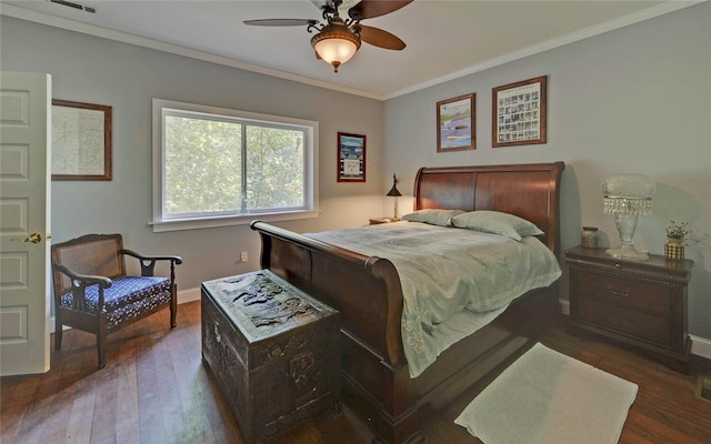 bedroom with ceiling fan, dark wood-type flooring, and crown molding