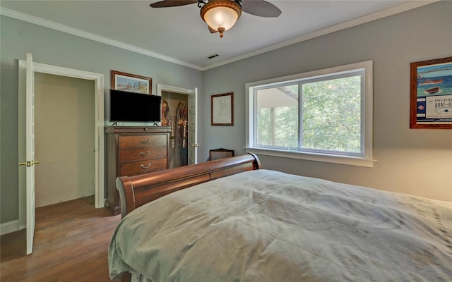 bedroom with wood-type flooring, ceiling fan, and crown molding