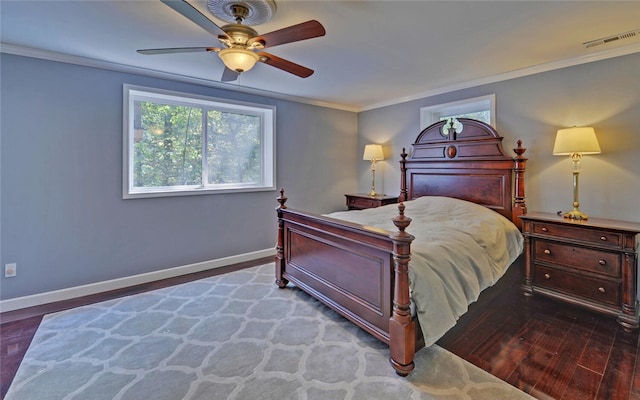 bedroom featuring ceiling fan, crown molding, and dark hardwood / wood-style flooring