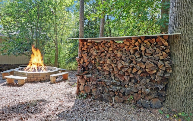 view of yard with an outdoor fire pit