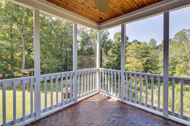 unfurnished sunroom featuring wooden ceiling