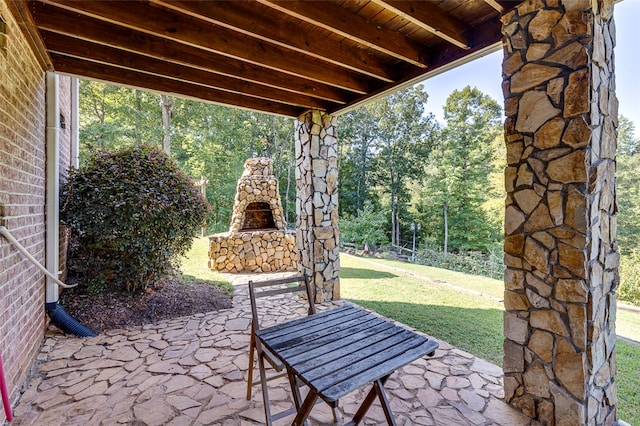 view of patio / terrace with an outdoor stone fireplace