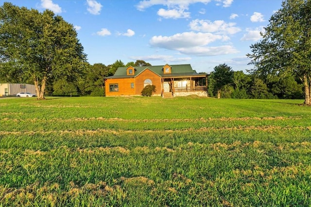 186 Woodville Rd, Pelzer, SC 29669 - view of front of house featuring a front lawn and covered porch