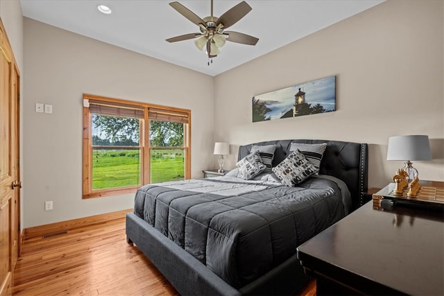 bedroom featuring light hardwood / wood-style floors and ceiling fan