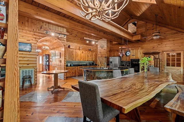 dining room with high vaulted ceiling, ceiling fan with notable chandelier, wooden ceiling, light hardwood / wood-style flooring, and sink