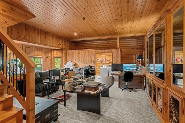 carpeted office with wooden walls, wood ceiling, and built in desk