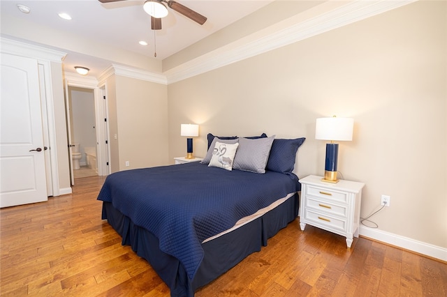 bedroom featuring crown molding, hardwood / wood-style floors, and ceiling fan