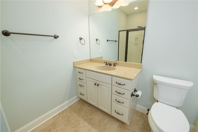 bathroom featuring vanity, toilet, tile patterned floors, and a shower with shower door