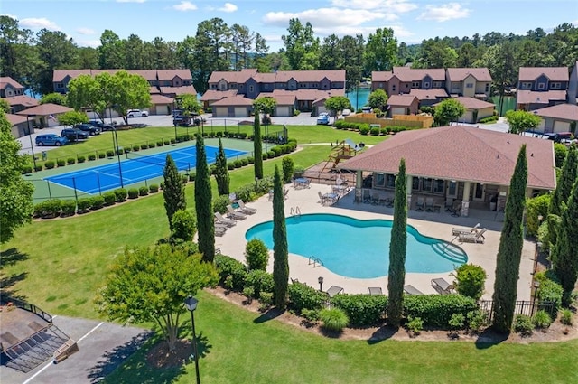 view of swimming pool with a yard and a patio area