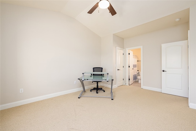 carpeted office featuring ceiling fan and vaulted ceiling