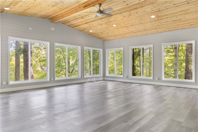 unfurnished sunroom with wooden ceiling, vaulted ceiling with beams, ceiling fan, and a wealth of natural light