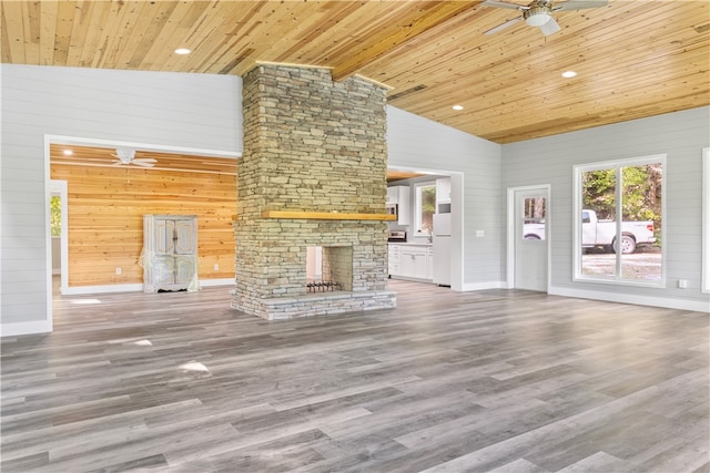 unfurnished living room with wood-type flooring and wooden ceiling