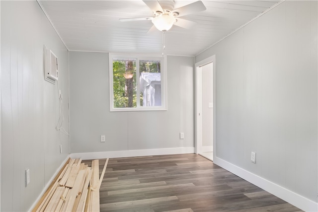 spare room featuring ceiling fan, crown molding, and dark wood-type flooring