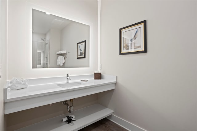 bathroom with vanity and wood-type flooring