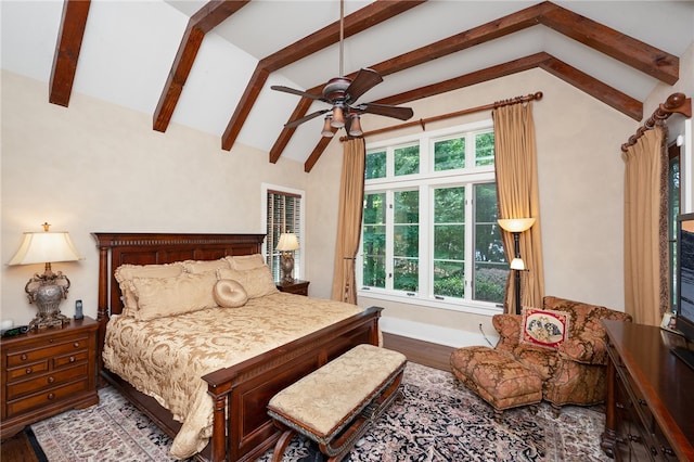 bedroom featuring wood-type flooring, lofted ceiling with beams, and ceiling fan