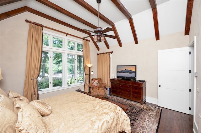 bedroom featuring vaulted ceiling with beams, multiple windows, dark hardwood / wood-style floors, and ceiling fan