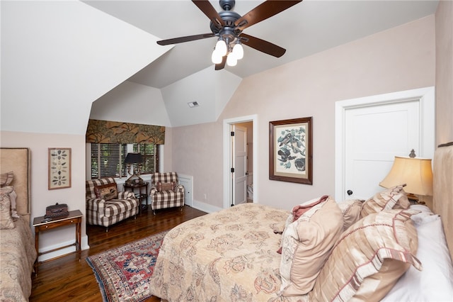 bedroom featuring vaulted ceiling, dark hardwood / wood-style flooring, and ceiling fan