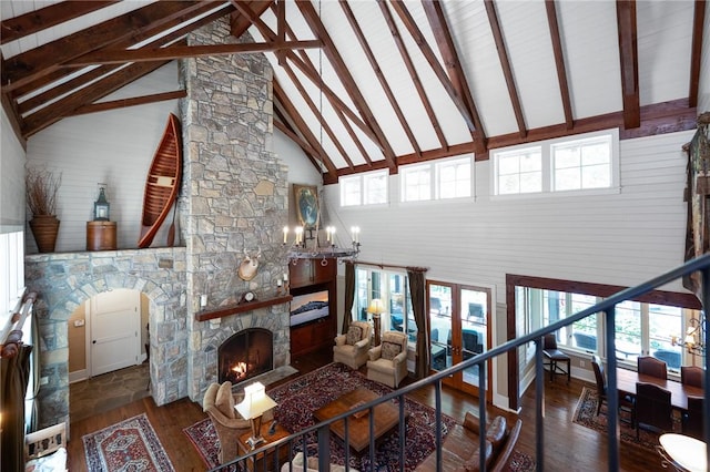202 Passion Flower Way, Sunset, SC 29685 - living area featuring high vaulted ceiling, hardwood / wood-style flooring, beamed ceiling, a fireplace, and a chandelier