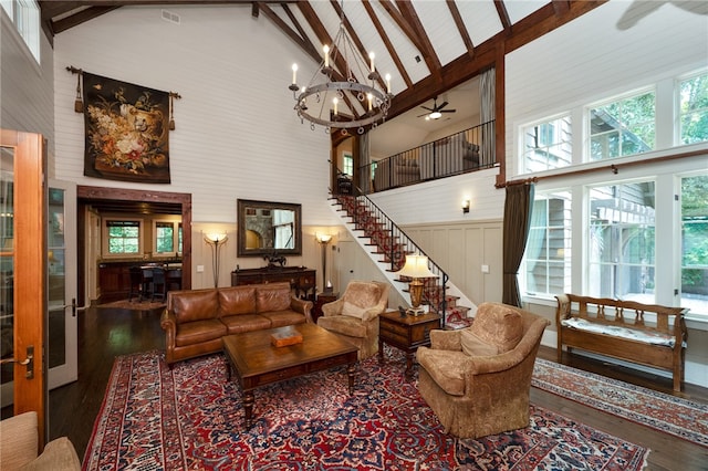 living room with high vaulted ceiling, beam ceiling, and hardwood / wood-style floors