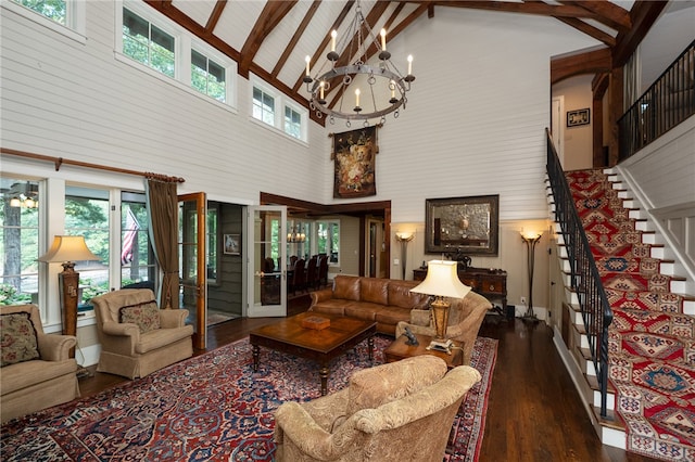 living room featuring high vaulted ceiling, beamed ceiling, dark hardwood / wood-style floors, and a healthy amount of sunlight