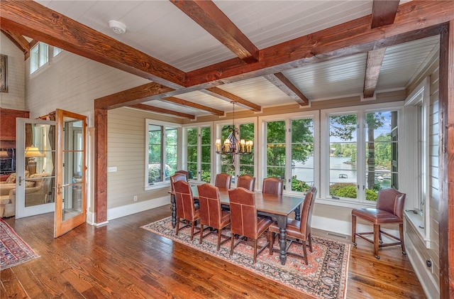 sunroom / solarium with an inviting chandelier, beamed ceiling, and plenty of natural light