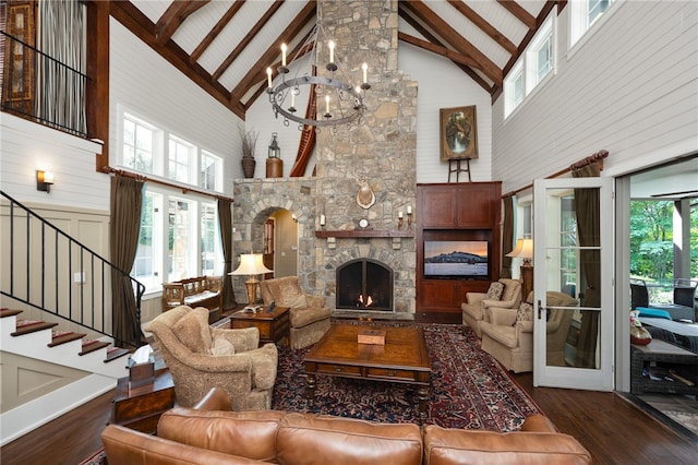 living room featuring high vaulted ceiling, dark wood-type flooring, beamed ceiling, and a fireplace