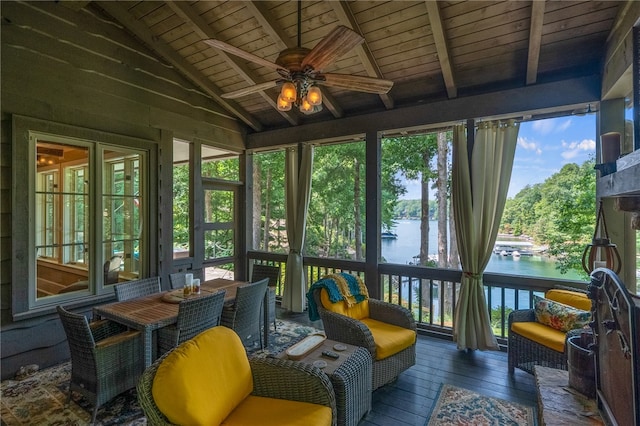 sunroom featuring lofted ceiling with beams, a water view, ceiling fan, and wooden ceiling