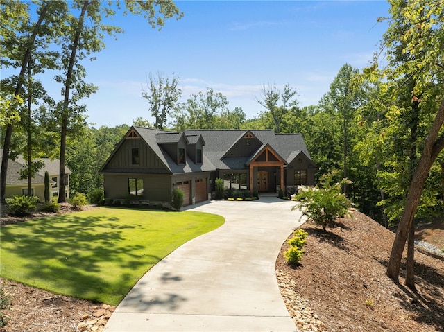 view of front of home featuring a garage and a front lawn