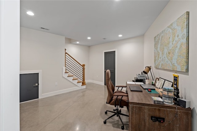 office area featuring concrete flooring