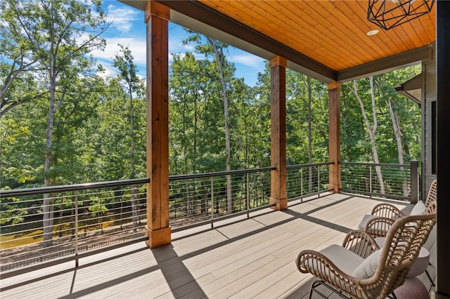 unfurnished sunroom with a wealth of natural light and wood ceiling