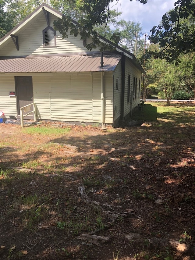 exterior space with a shed