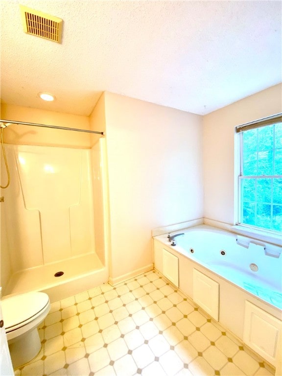 bathroom featuring independent shower and bath, a textured ceiling, and toilet