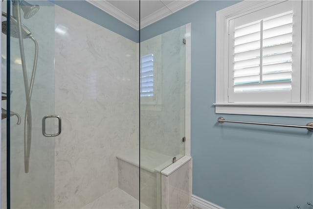 bathroom featuring a shower with shower door and ornamental molding