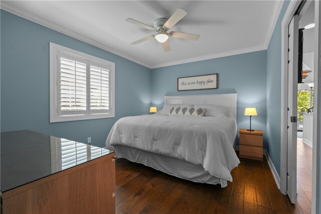 bedroom featuring crown molding, ceiling fan, and dark hardwood / wood-style flooring