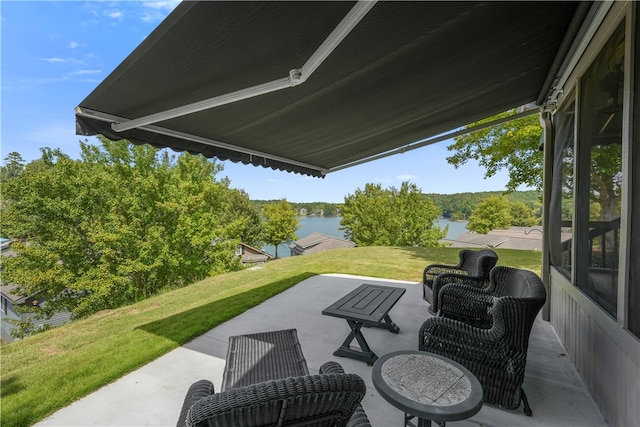 view of patio featuring a water view