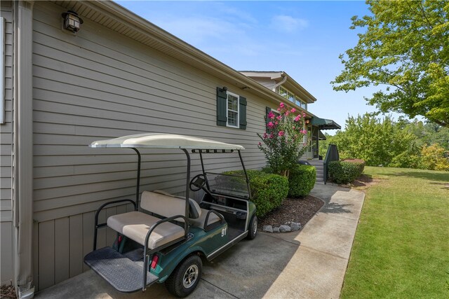 view of side of property with a yard