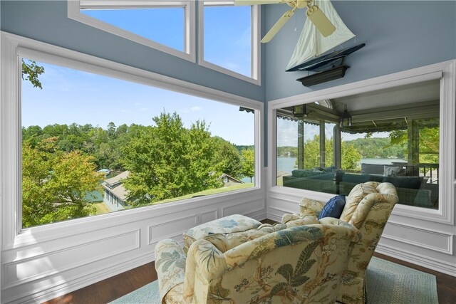 sunroom featuring ceiling fan