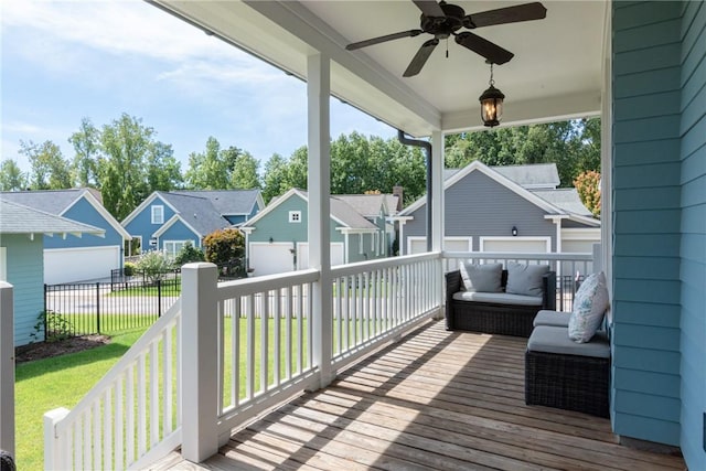 deck featuring a lawn and ceiling fan