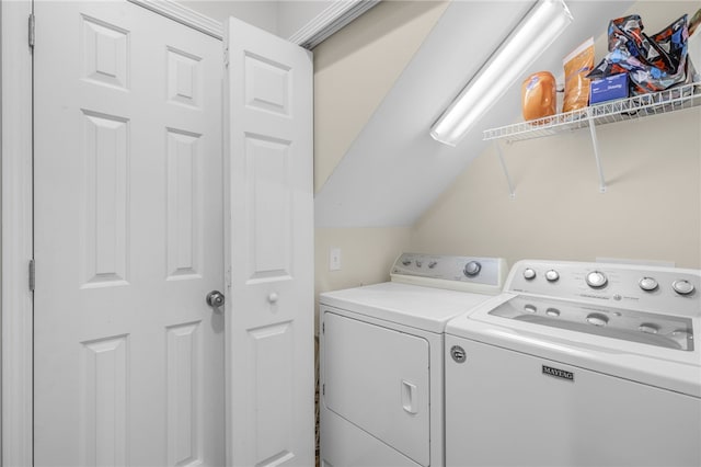 washroom with washing machine and clothes dryer