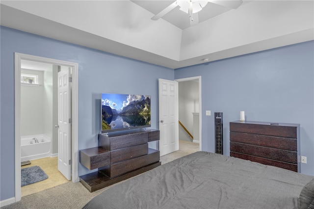 bedroom with ensuite bath, ceiling fan, and light colored carpet