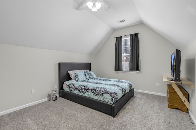 bedroom featuring ceiling fan, carpet floors, and vaulted ceiling