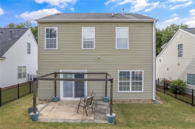 back of house with a yard and a patio area