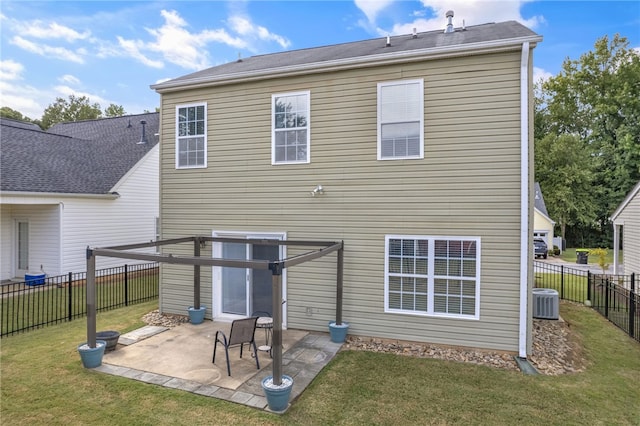 back of house featuring a lawn, a patio, and central AC