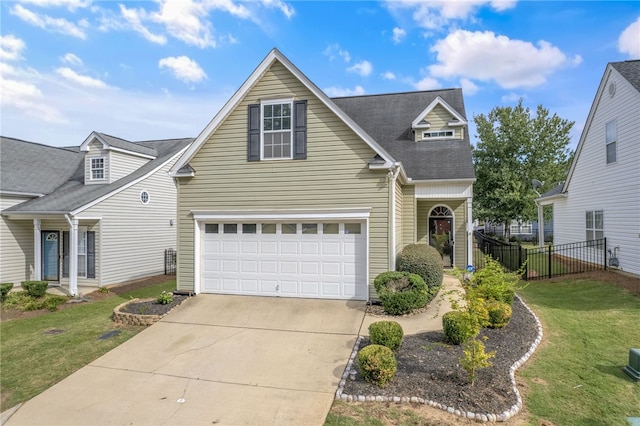 front of property with a front lawn and a garage