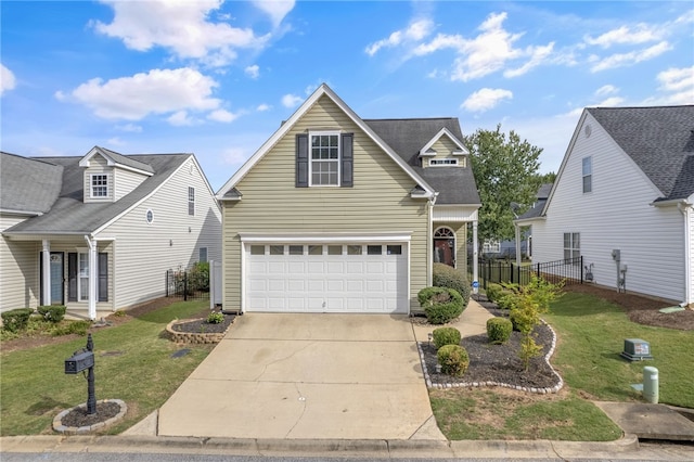 front of property featuring a garage and a front lawn