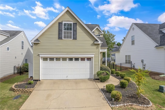 view of front property with a front yard and a garage