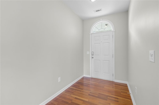 foyer with dark hardwood / wood-style flooring